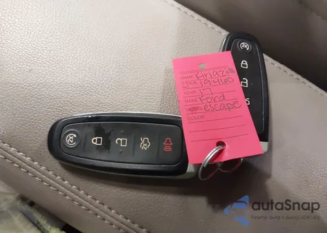 2017 Ford Escape Titanium z USA, uszkodzony, nr VIN 1FMCU9J98HUD02977